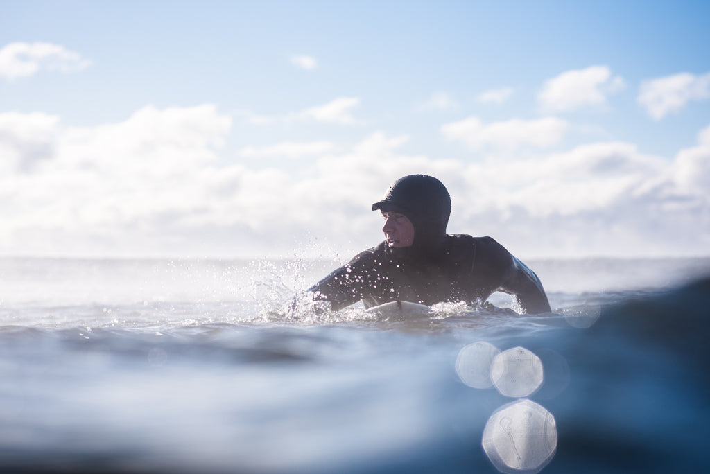 Swimming In Surf During New England Winter by Cate Brown